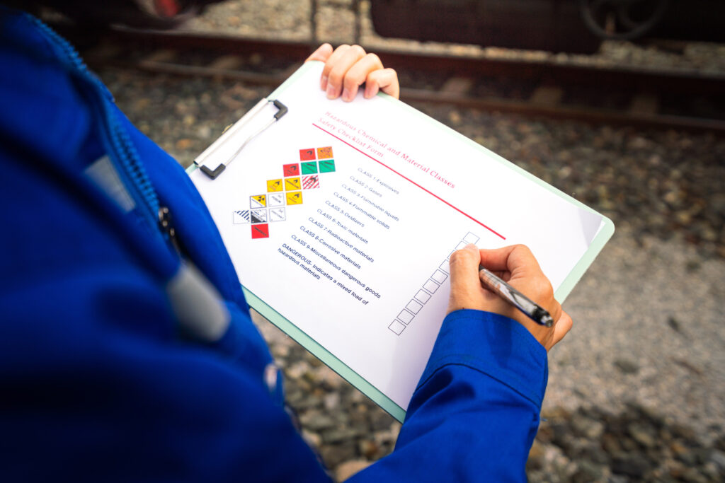 Person filling out compliance worksheet